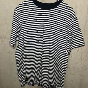 White and Black striped Supreme t shirt.